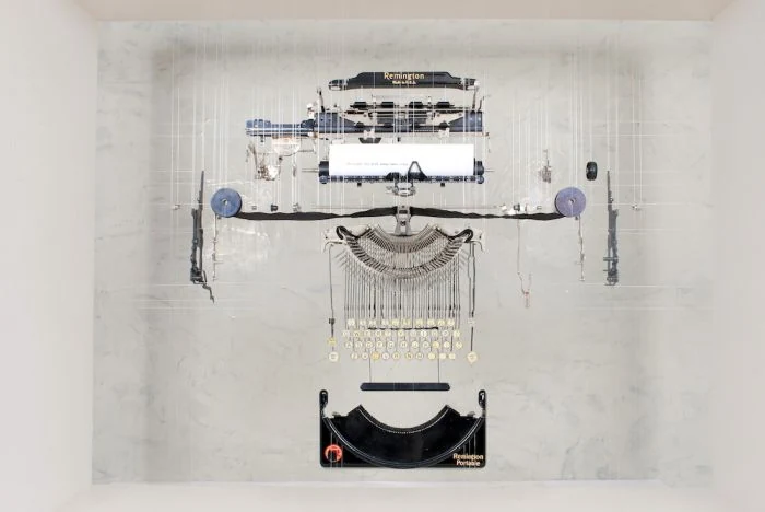 Fine artist John Peralta “explodes” our most beloved machines to create elegant sculptural works