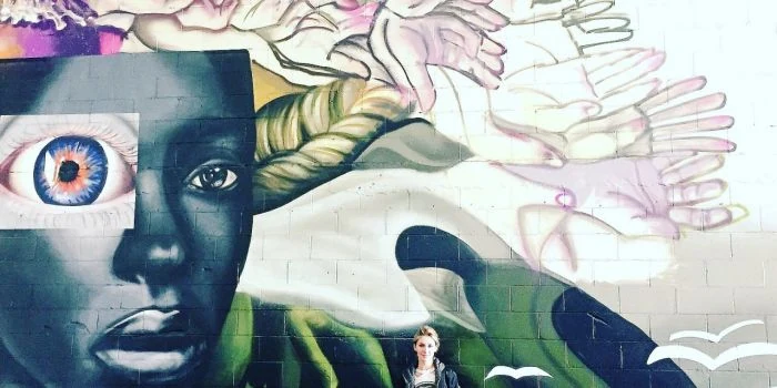 #NotACrime: Street Artist ELLE Promotes Education Equality Through Public Murals